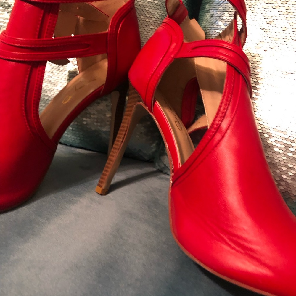 Never worn before heels. Beautiful red ankle boots to compliment your legs